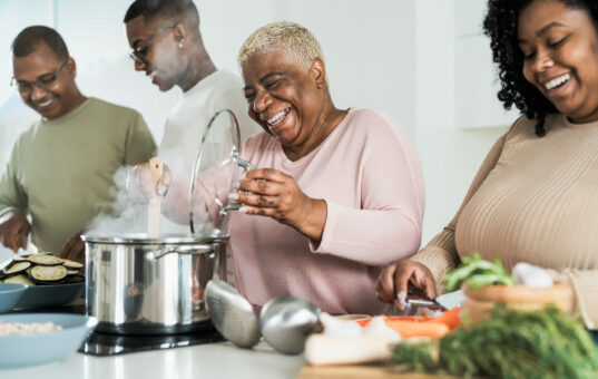 Happy,Black,Family,Having,Fun,Cooking,Together,In,Modern,Kitchen